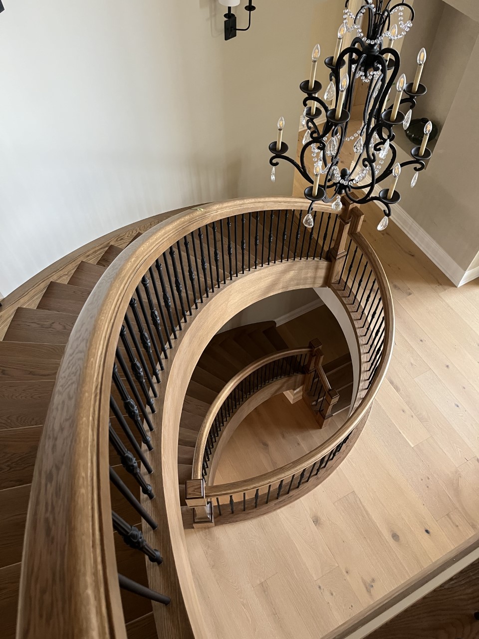 curved stair with chandelier higher res